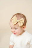 Adventure Bow - Butterscotch Gingham on Nylon Headband